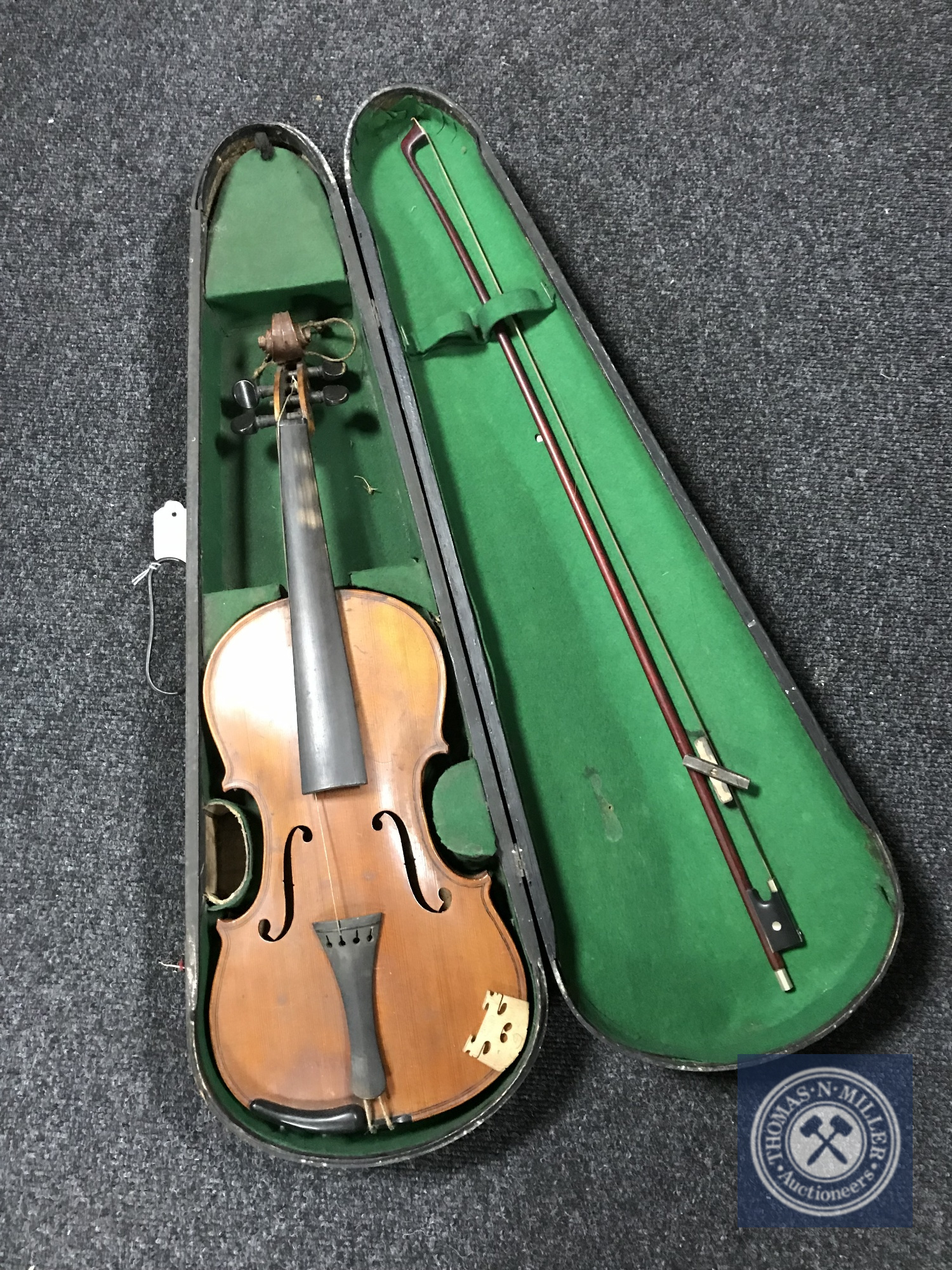 A late 19th/20th century violin and bow in coffin case,