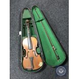 A late 19th/20th century violin and bow in coffin case,