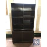 A set of Danish mahogany bookshelves with cupboard beneath