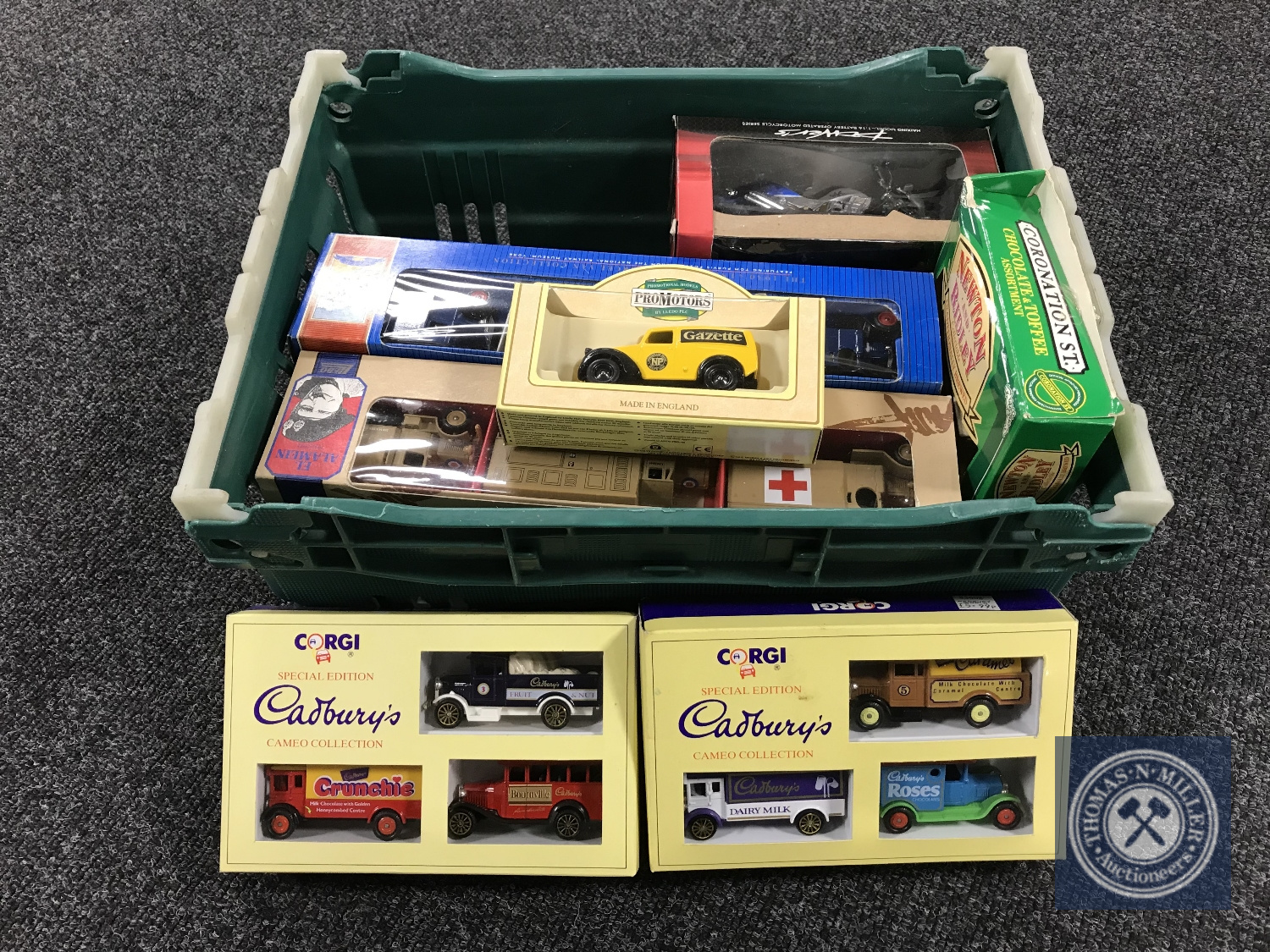 A box of boxed die cast vehicles - Corgi and Lledo