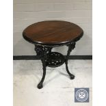 A circular Britannia pub table on cast iron base