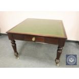 A Victorian mahogany library table with tooled green leather top, 104 cm x 107 cm.