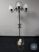 A cast metal three branch standard lamp