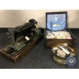 A cased vintage sewing machine,