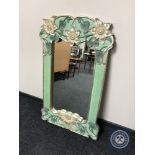 A contemporary hand painted wall mirror