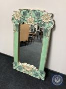 A contemporary hand painted wall mirror