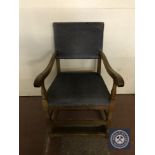 A twentieth century oak armchair upholstered in blue fabric