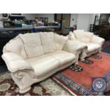 A three and two seater cream leather settee (2)