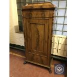 A 19th century mahogany sentry door cabinet on claw feet