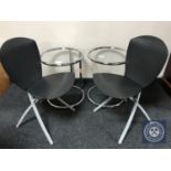 A pair of chrome glass topped lamp tables together with a pair of contemporary folding chairs