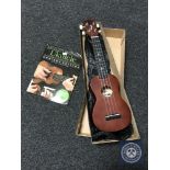 A Stagg ukulele with carry bag in box and a beginners hand book