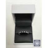 An 18ct white gold sapphire and diamond eternity ring CONDITION REPORT: Size V.