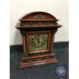 A mahogany arch top bracket clock with brass dial