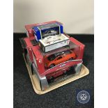 A tray of eight boxed die cast vehicles, Burago,