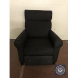 A contemporary armchair in black fabric