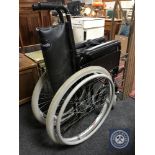 A folding Wheeltech wheel chair