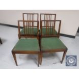 A set of four mid twentieth century rail backed kitchen chairs