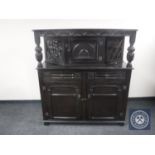 A carved oak buffet backed sideboard