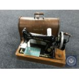 An oak cased vintage hand Singer sewing machine