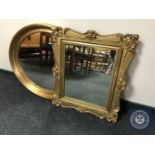 An ornate gilt framed mirror together with an oval gilt framed mirror