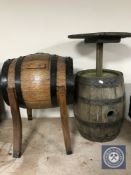 An oak coopered barrel in the form of an occasional table and An oak coopered barrel on stand