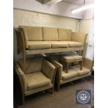 A late twentieth century wooden framed lounge suite comprising of three seater sofa,
