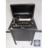 An early 20th century The Dictaphone Shaving Machine by The Columbia Gramophone Company in cabinet