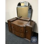 A mid 20th century walnut dressing chest