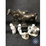 A contemporary bronze effect of two horses on plinth and four china Spanish figures