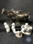 A contemporary bronze effect of two horses on plinth and four china Spanish figures