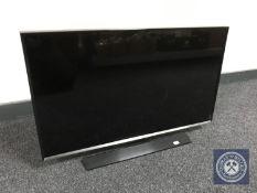 A Samsung model T-32 E 310EX LED TV with remote