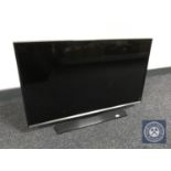 A Samsung model T-32 E 310EX LED TV with remote