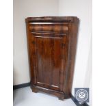 A late nineteenth century mahogany corner cabinet