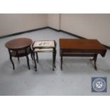 A mahogany flap sided sofa coffee table fitted with two drawers together with a circular mahogany