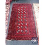 An Afghan Tekke rug on red ground,