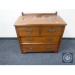 An Edwardian mahogany four drawer chest