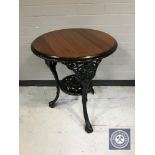 A circular Britannia pub table on cast iron base