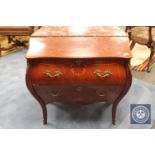 A reproduction ormolu mounted two drawer bombe chest,