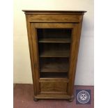 An early 20th century walnut display cabinet on bun feet (key with saleroom staff)