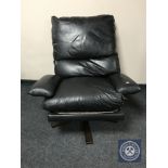 A 20th century continental black leather swivel armchair