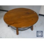 A circular pine "wagon wheel" coffee table