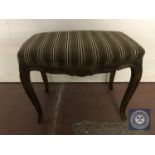 A French upholstered dressing table stool