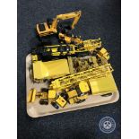 A tray of assorted plastic and die cast vehicles including JCB farming equipment, Hercules crane,