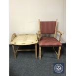 A blonde oak carver armchair together with a blonde oak butler's tray on stand