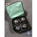 A Welkin bag containing four Taylor Elite lawn balls