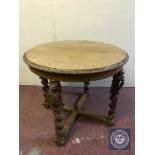 A circular oak centre table