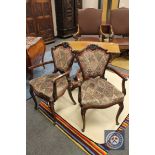 A pair of Victorian mahogany salon armchairs.