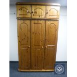 A pine triple door wardrobe