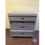An antique oak painted four drawer chest
