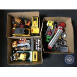 Three boxes of plastic vehicles including fork lift truck, tanker,